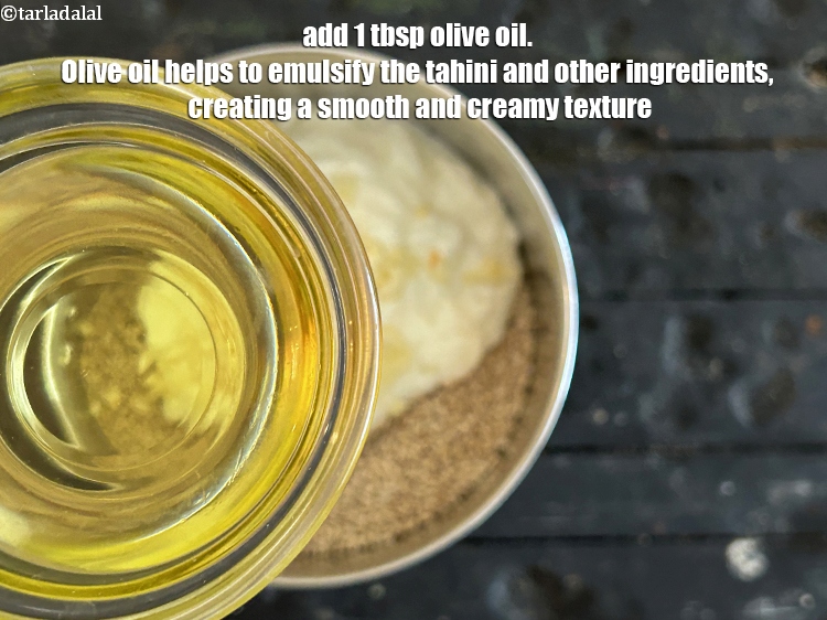 Step 38 – Add&nbsp;<strong>1&nbsp;tbsp olive oil.</strong>&nbsp;Olive oil helps to emulsify the tahini and other ingredients, creating a smooth …