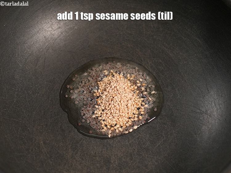 Step 27 – Add&nbsp;1 tsp&nbsp;<a href="https://www.tarladalal.com/glossary-sesame-seeds-til-gingelly-seeds-612i">sesame seeds (til)</a>.