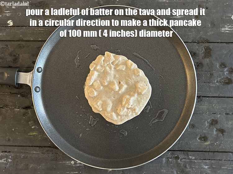 Step 20 – Pour a ladleful of the batter on the tava&nbsp;and spread in a circular motion to …