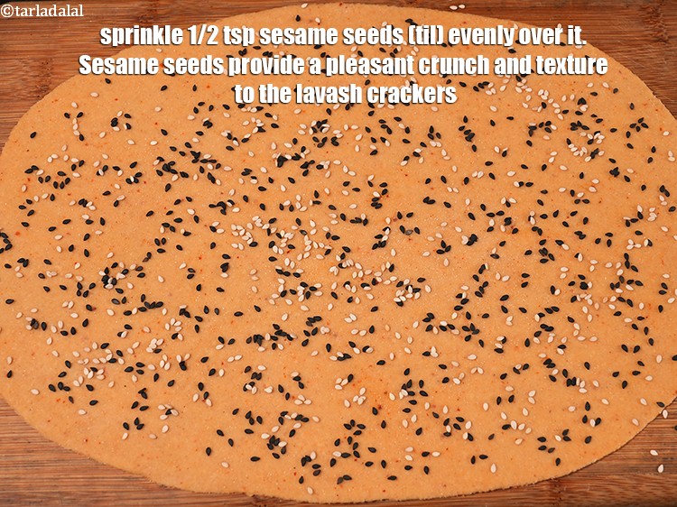 Step 21 – <p>Sprinkle 1/2 tsp&nbsp;<a href="https://www.tarladalal.com/glossary-sesame-seeds-til-gingelly-seeds-612i">sesame seeds (til)</a>&nbsp;evenly over it.&nbsp;Sesame seeds provide a pleasant crunch and texture …