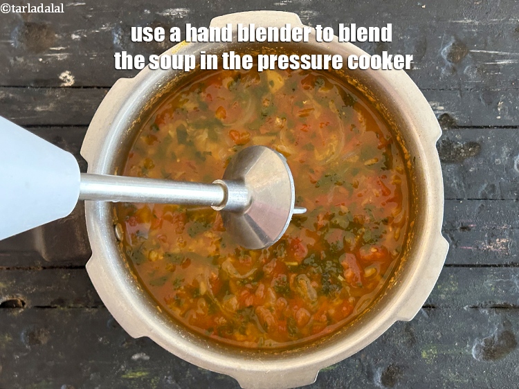 Step 20 – Use a hand blender to blend the soup in the pressure cooker.