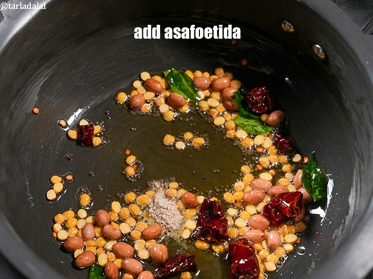 Step 20 – Add &frac14; tsp <a href="https://www.tarladalal.com/glossary-asafoetida-hing-113i">asafoetida (hing)</a>.&nbsp;