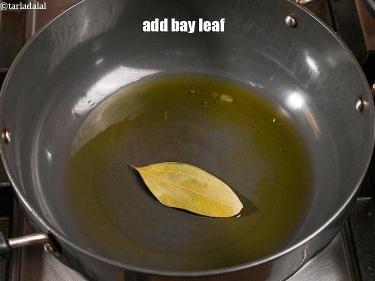Step 20 – Add 1 <a href="https://www.tarladalal.com/glossary-bay-leaf-tejpatta-bay-leaves-189i">bay leaf (tejpatta)</a>.
