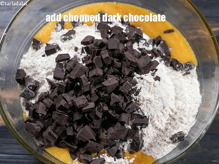 Step 20 – Add 1 cup&nbsp;<a href="https://www.tarladalal.com/glossary-chopped-dark-chocolate-792i">chopped dark chocolate</a>.