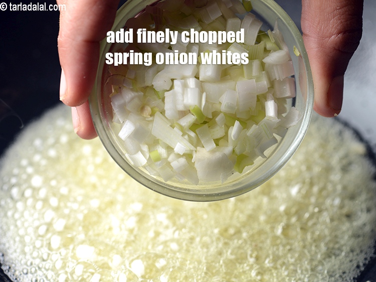 Step 21 – Add &frac14; cup finely&nbsp;<a href="https://www.tarladalal.com/glossary-chopped-spring-onion-whites-815i">chopped spring onions whites</a>.