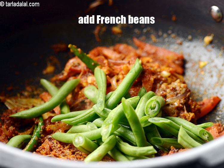 Step 20 – Add &frac12; cup <a href="https://www.tarladalal.com/glossary-diagonally-cut-french-beans-2461i">diagonally cut french beans</a>.