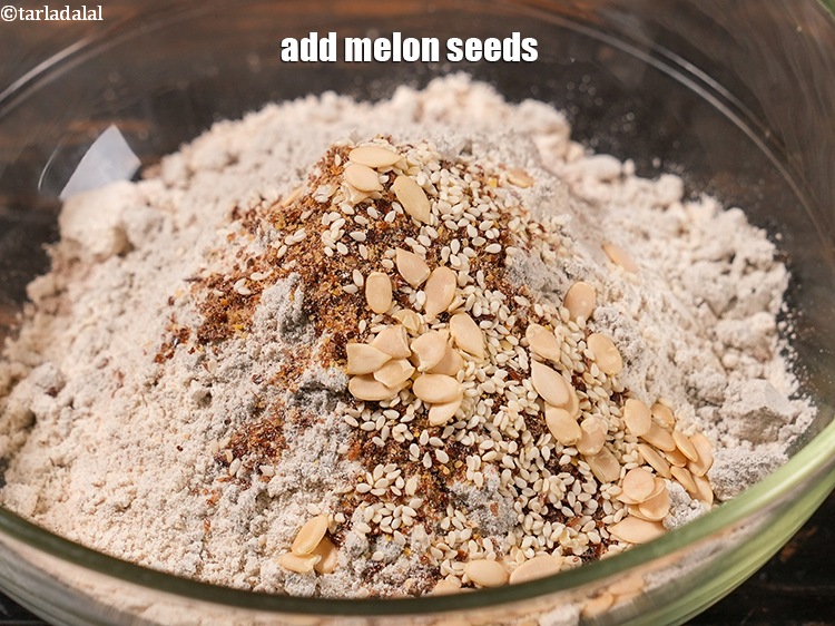 Step 19 – Add melon seeds. To provide a nice bite to the <strong>multi seeds bread</strong>.