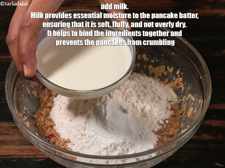 Step 20 – Add &frac14; cup <a href="https://www.tarladalal.com/glossary-milk-doodh-full-cream-milk-514i">milk</a>. Milk provides essential moisture to the pancake batter, ensuring that …
