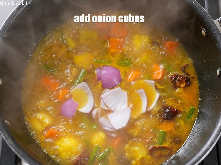 Step 20 – Add &frac14; cup <a href="https://www.tarladalal.com/glossary-onion-cubes-732i">onion cubes</a>.