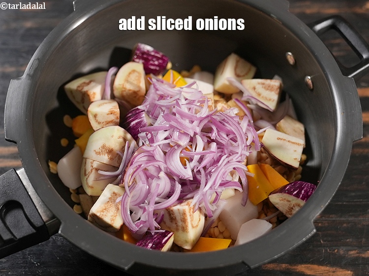 Step 20 – Add &frac12; cup <a href="https://www.tarladalal.com/glossary-sliced-onions-745i">sliced onions</a>.&nbsp;