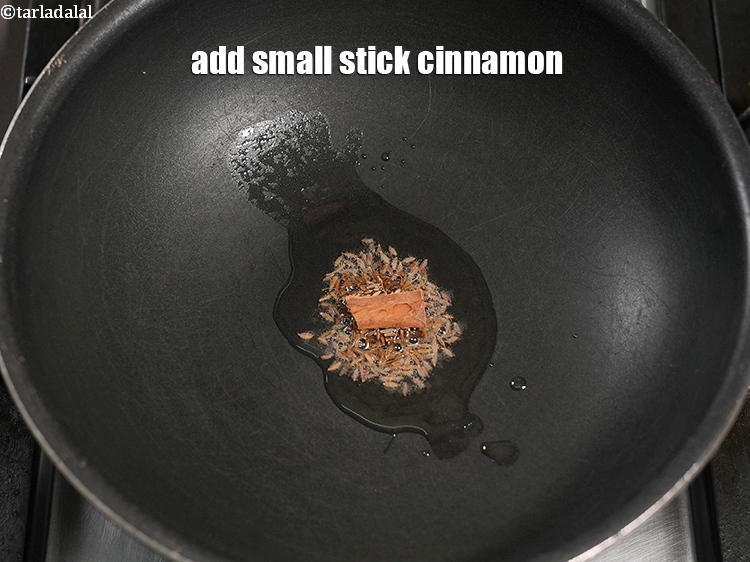 Step 21 – Add 1 small stick <a href="https://www.tarladalal.com/glossary-cinnamon-dalchini-346i">cinnamon (dalchini)</a>.