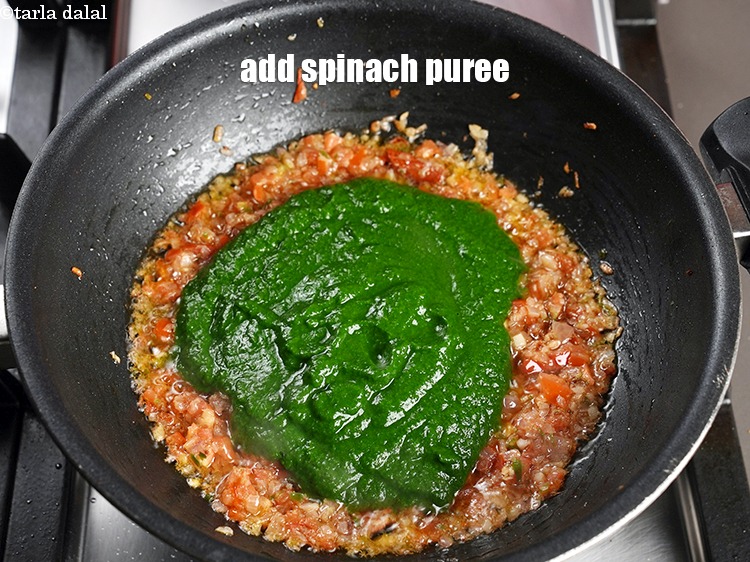 Step 25 – Add 1 cup <a href="https://www.tarladalal.com/glossary-spinach-puree-palak-ki-puree-256i">spinach (palak) puree</a>.