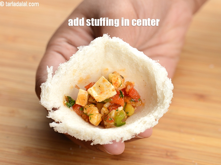 Step 20 – Add 1&frac12; tsp of stuffing in the center.