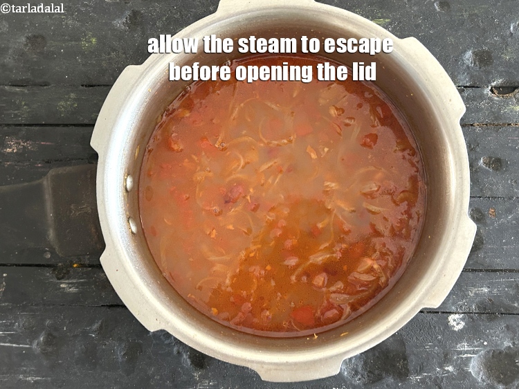 Step 24 – Allow the steam to escape before opening the lid.