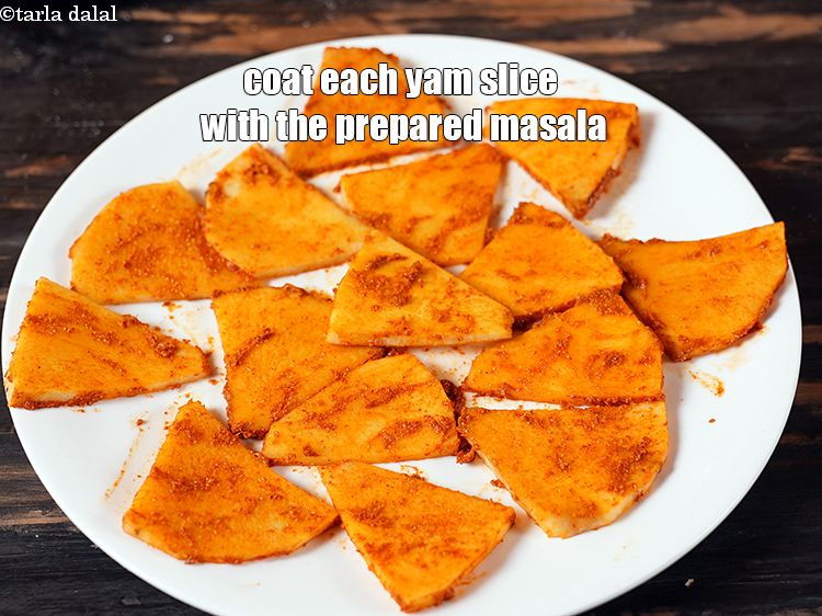 Step 20 – Coat each yam slice with the prepared masala.