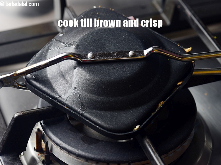 Step 21 – Cook on a medium flame, till it turns brown and crisp from both the sides.