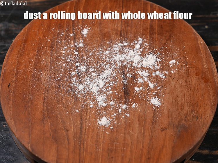Step 23 – Dust a rolling board with whole wheat flour.