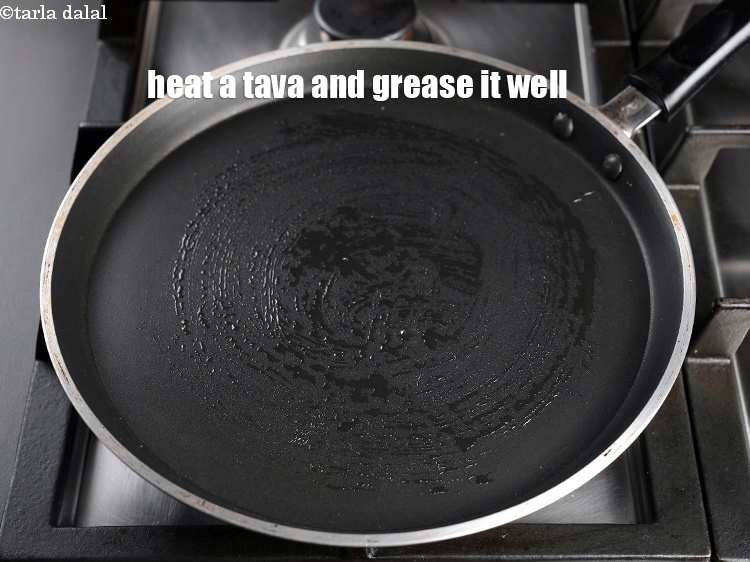 Step 20 – Heat a non-stick tava (griddle), grease it well using &frac14; tsp of oil.