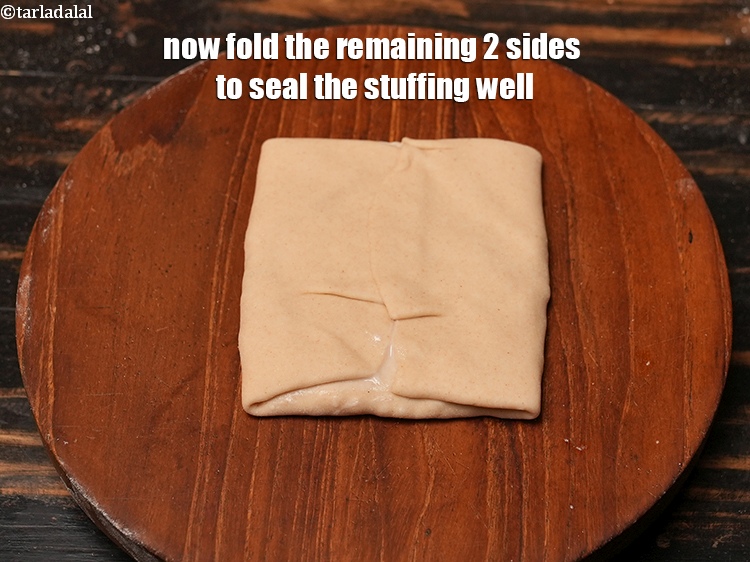 Step 28 – Now fold the remaining 2 sides to seal the stuffing well.