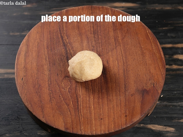Step 20 – Press a portion of the dough on a rolling board.