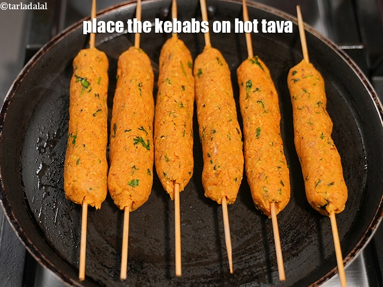 Step 23 – Place the kebabs on hot tava.