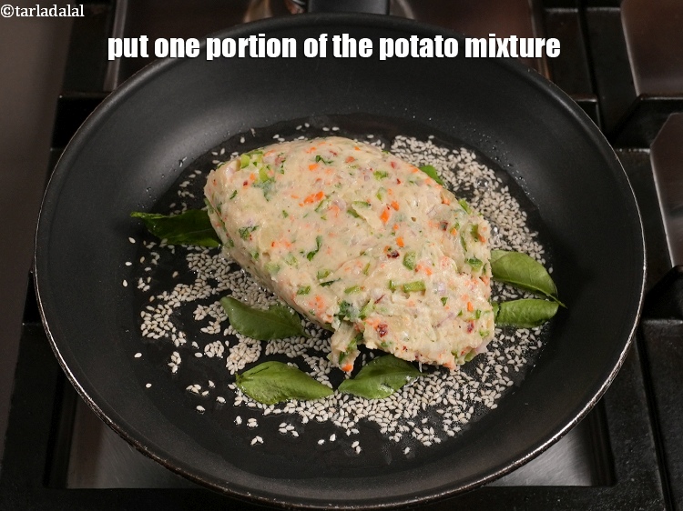 Step 20 – Put one portion of the potato mixture.