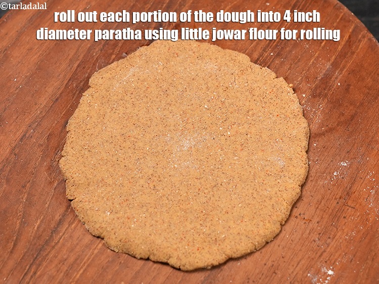 Step 21 – Roll out each portion of the dough into 4 inch diameter paratha using little jowar …