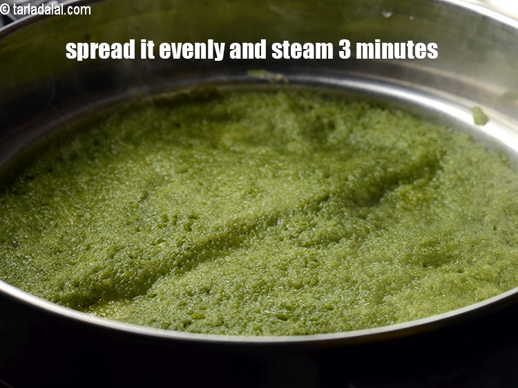 Step 21 – Spread it evenly and steam on medium flame for 3 minutes.