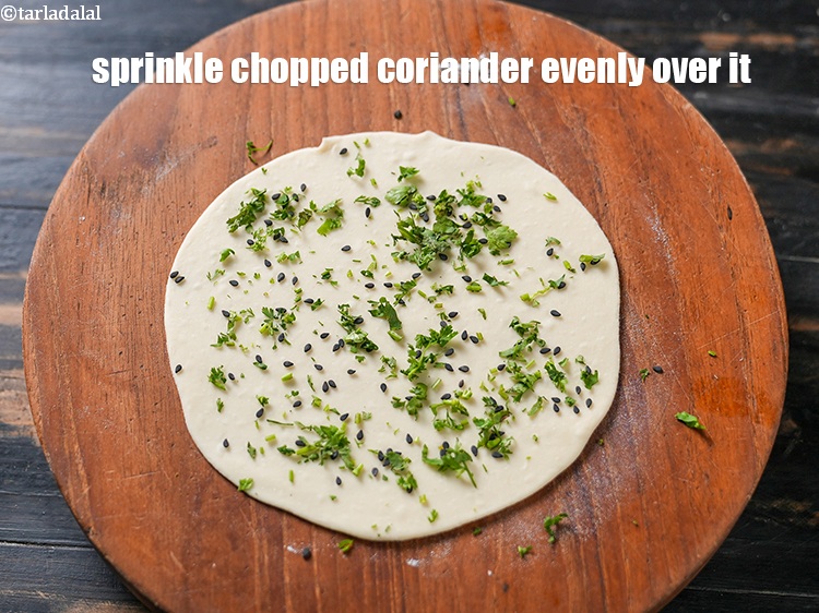 Step 20 – Sprinkle 1 tsp <a href="https://www.tarladalal.com/glossary-chopped-coriander-783i">chopped coriander (dhania)</a> evenly over it.