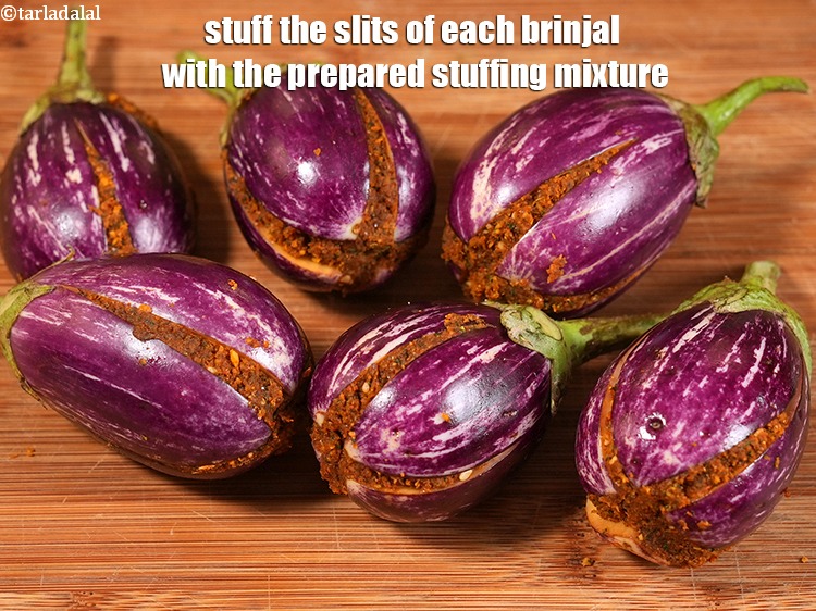 Step 20 – Stuff the slits of each brinjal with the prepared stuffing mixture.