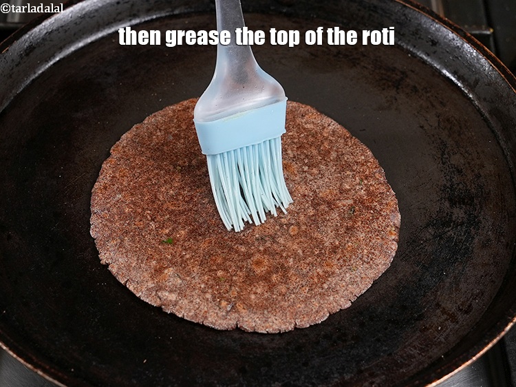 Step 22 – Then grease the top of the roti.