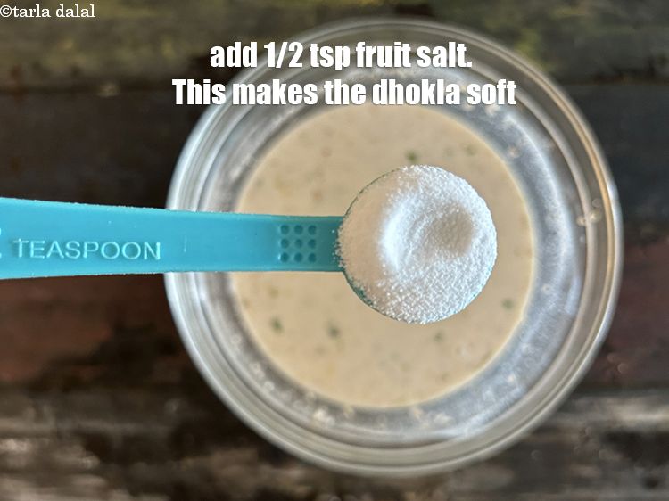 Step 40 – <meta charset="UTF-8" />Add 1/2 tsp fruit salt<strong>&nbsp;(optional)</strong>.&nbsp;<strong>This makes the dhokla soft and we prefer to …