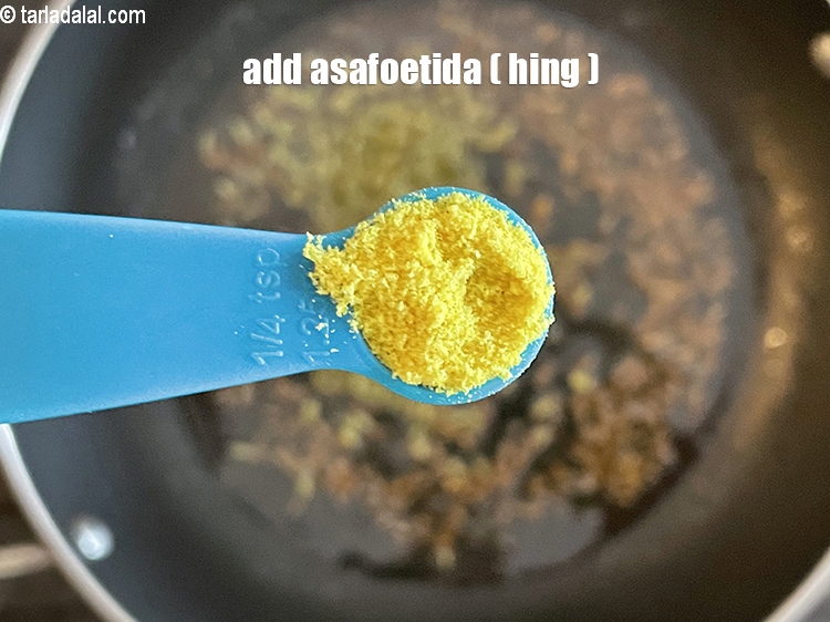 Step 25 – Add&nbsp;<meta charset="UTF-8" />1/4 tsp&nbsp;<a href="glossary-asafoetida-hing-113i">asafoetida (hing)</a>.