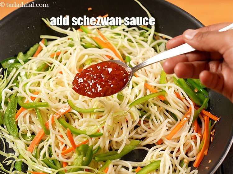 Step 21 – Add 3 tsp <a href="https://www.tarladalal.com/glossary-schezwan-sauce-schezuan-sauce-1872i">schezwan chutney</a>.