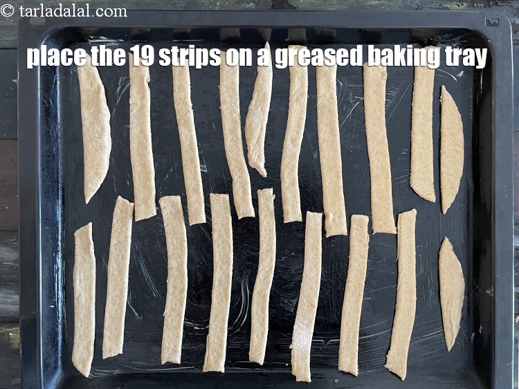 Step 23 – <meta charset="UTF-8" /> Place the strips on the baking tray.&nbsp;<u><em>You will get a total of …