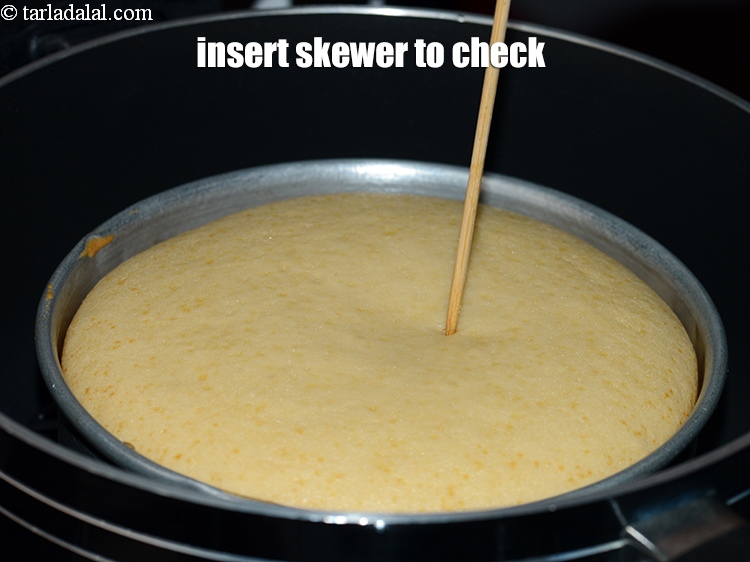 Step 22 – Insert a skewer to check the cake is properly baked.
