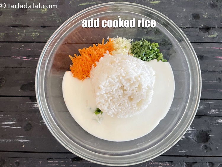 Step 20 – Add&nbsp;<meta charset="UTF-8" />1 cup&nbsp;cooked&nbsp;<a href="glossary-rice-chawal-533i">rice (chawal)</a>. You can mash it lightly if you want.