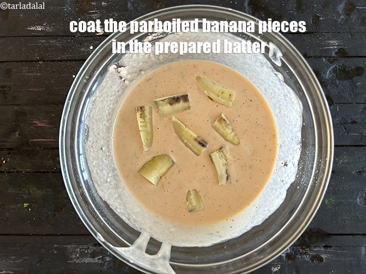 Step 20 – Coat the parboiled raw banana pieces in the prepared batter.