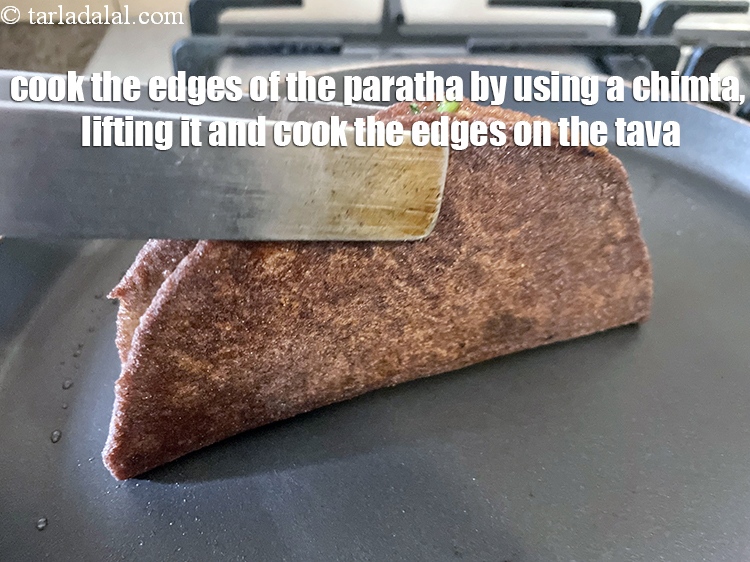 Step 33 – <meta charset="UTF-8" /> You will have to cook the edges of the paratha by using …