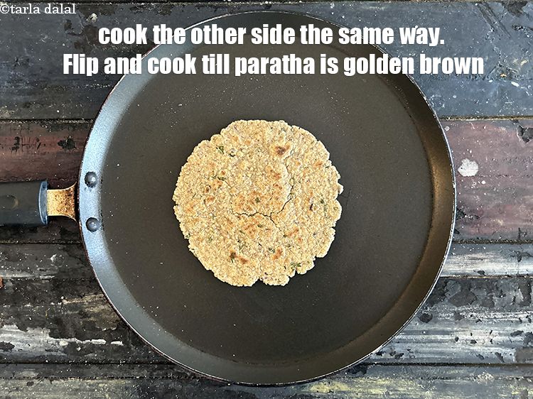 Step 21 – Cook the other side the same way. Flip and cook the oats paratha till golden …