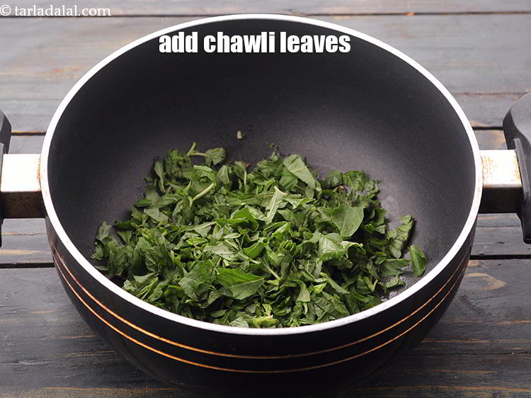 Step 34 – Add the chawli leaves can be substituted with <a href="https://www.tarladalal.com/glossary-spinach-palak-255i" target="_blank">spinach leaves</a> or <a href="https://www.tarladalal.com/glossary-fenugreek-leaves-methi-methi-leaves-methi-ke-patte-methi-ki-bhaji-373i" …
