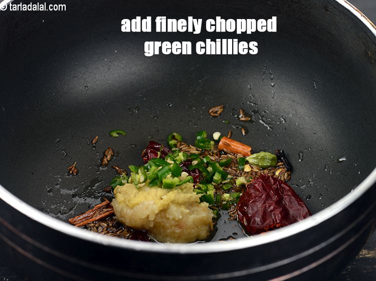 Step 20 – Add 1 tsp finely <a href="https://www.tarladalal.com/glossary-chopped-green-chilli-820i">chopped green chillies</a>.