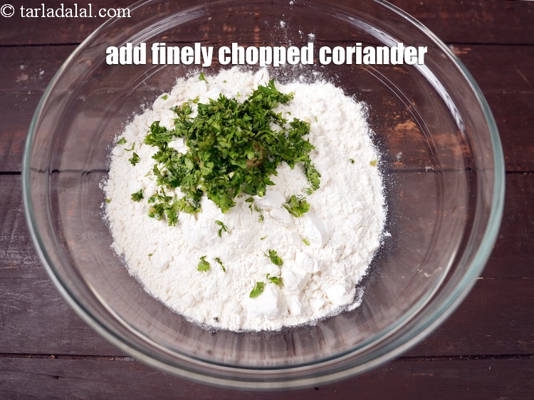Step 21 – Add 2 tsp finely <a href="https://www.tarladalal.com/glossary-chopped-coriander-783i">chopped coriander (dhania)</a>.