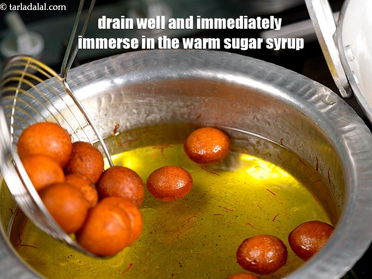 Step 20 – Drain well and immediately immerse in the warm sugar syrup. Make sure the sugar syrup …