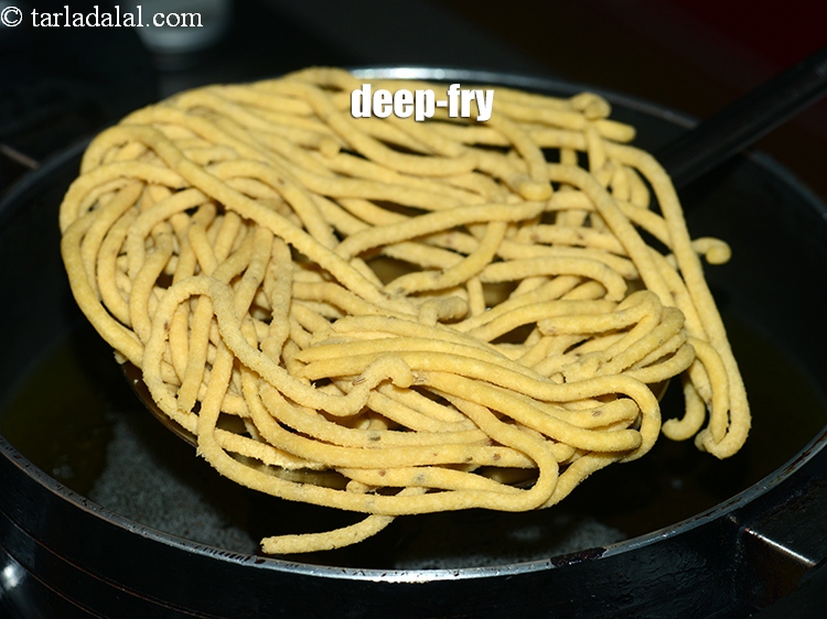 Step 21 – Deep-fry the gathiya on a slow flame, till they turn light yellow in colour and …