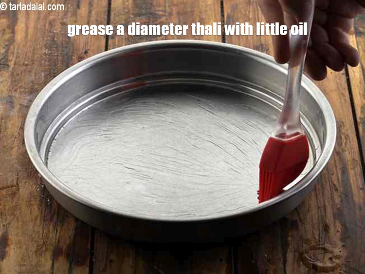 Step 21 – Grease a 175 mm. (7&quot;) diameter thali with little oil. Keep aside. Note that we …