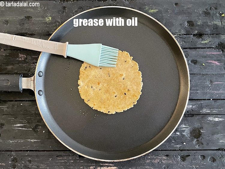 Step 20 – <meta charset="UTF-8" />Grease with &nbsp;&frac14; tsp of oil or ghee.&nbsp;<br /> &nbsp;