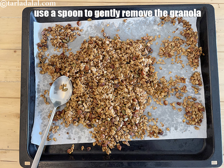 Step 23 – Use a spoon to gently remove the granola from the parchment paper.