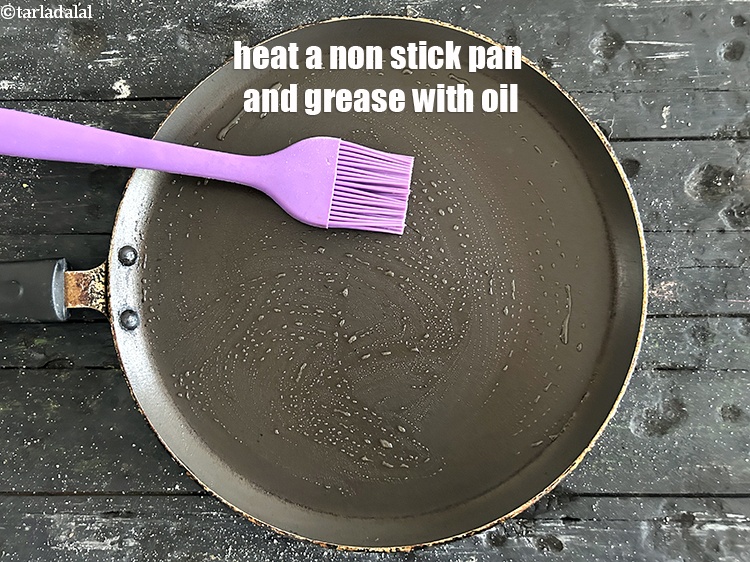 Step 29 – Heat a non-stick tava (griddle) and grease it using &frac14; tsp of oil.