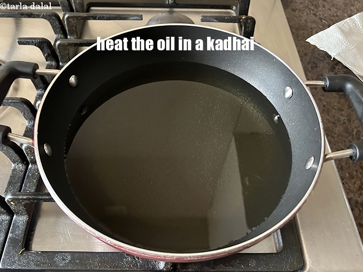 Step 21 – Heat the oil in a kadhai.